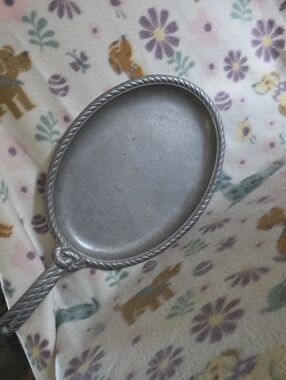 Wilton Armetale Gourmet Grillware 15" Sizzle Platter with a rope-edge border.